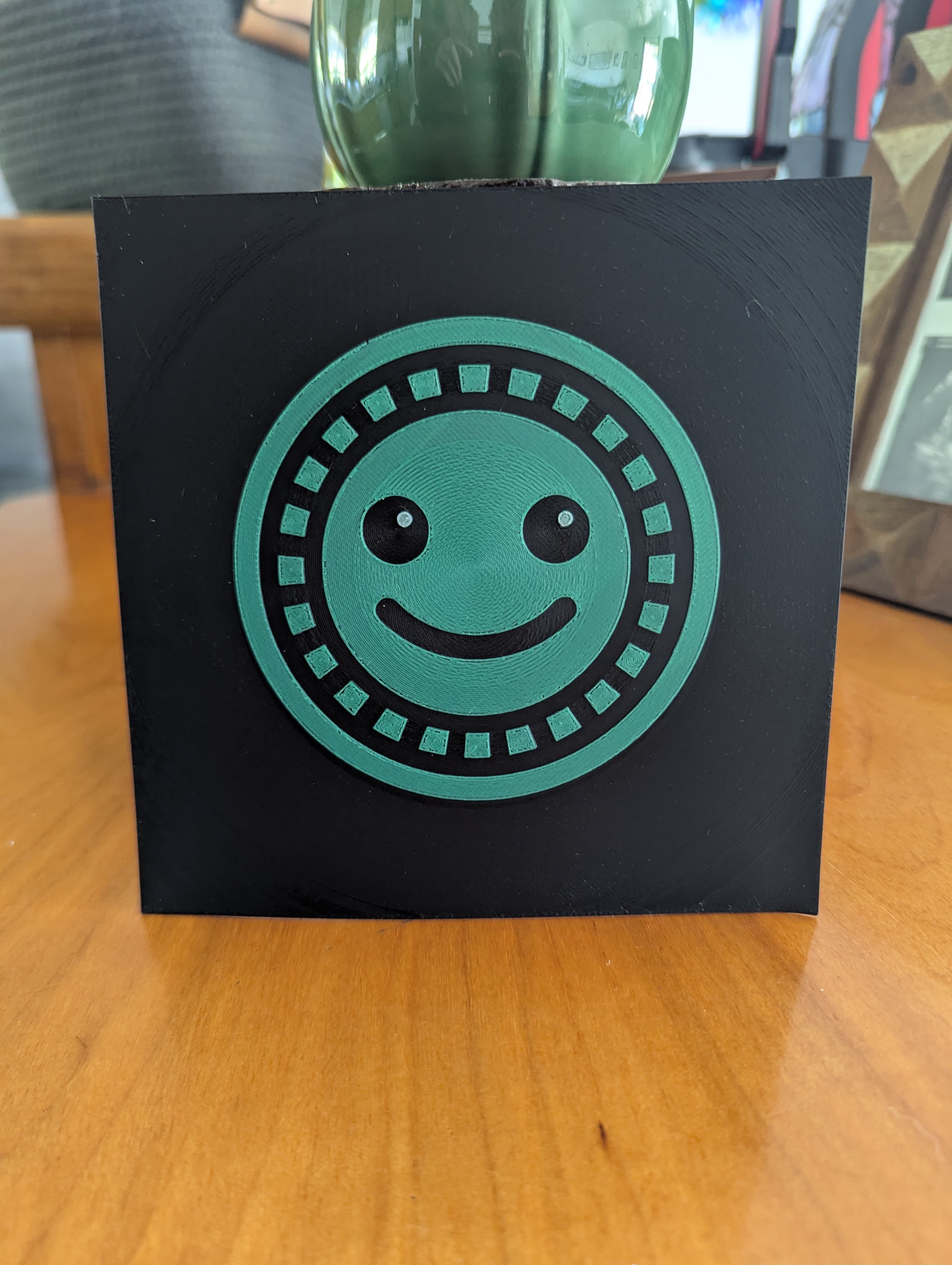 Filament print of a green smiley logo